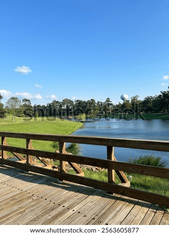Lake with trees in background from a bridge standpoint. 