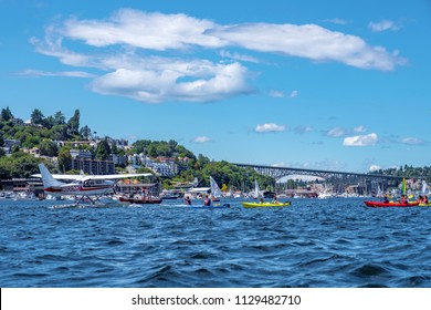 Lake Union, Seattle, WA - July 7, 2018: Sea Plane Taking Off Between Group Of Kayakers