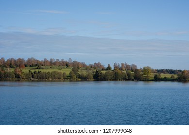 Lake View Of Mälaren At Adelsö And Björkö, Birka, In Stockholm A Pale Autumn Day With Blue Sky And Sea With  Clouds And Orange Leafs