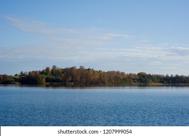 Lake View Of Mälaren At Adelsö And Björkö, Birka, In Stockholm A Pale Autumn Day With Blue Sky And Sea With  Clouds And Orange Leafs