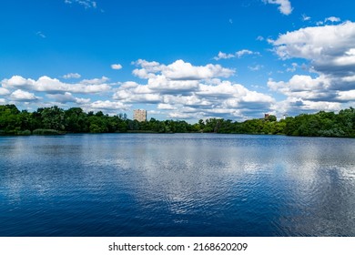 Lake view in the park, blue sky and clouds