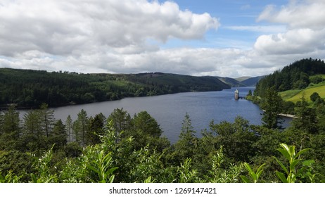 LAke Vyrnwy, Wales, with blue cloudy skies and ripples on the water.