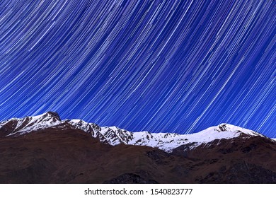 Lake Wanaka Snow Capped Mountain With Star Trails	