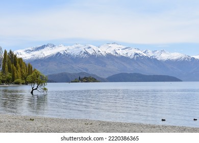 Lake Wanaka With Snow Capped Mountains In The Background