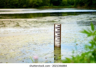 Lake Water Level Sign In Falenty, Poland. Water Level Depth Meter In The Pond