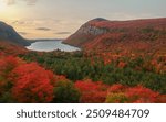 Lake Willoughby in Autumn Aerial View Peak Fall Foliage Colors at Sunrise. Orange Trees and Calm Lake in Small Vermont Town