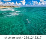 The Lake Worth Florida Pier and Waves on the beach