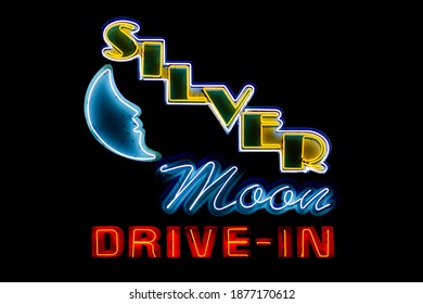 Lakeland, Florida - October 14 2019: The main neon sign featuring a moon at the Silver Moon Drive-in, built in 1948.