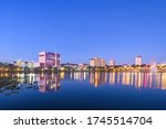 Lakeland, Florida, USA downtown cityscape on the lake at twilight.