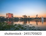 Lakeland, Florida, USA downtown cityscape on the lake at dawn.