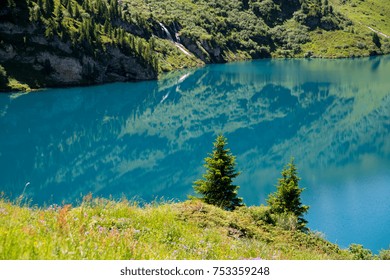 The Lakes Along The Four Lakes Trail Near Engelberg In The Heart Of Switzerland. Blue Water, Reflections, And Beautiful Green Surroundings In Summer