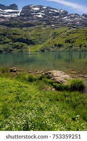 The Lakes Along The Four Lakes Trail Near Engelberg In The Heart Of Switzerland. Blue Water, Reflections, And Beautiful Green Surroundings In Summer