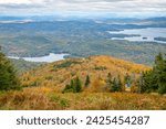 Lakes, forests, and distant mountains seen from atop Mount Sunapee in NH