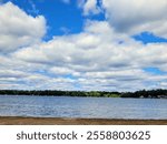 lakescape with fluffy clouds, beautiful cloudy day