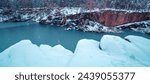 Lakeshore covered with snow in winter. View of the beautiful lake in snowy winter Horizontal banner