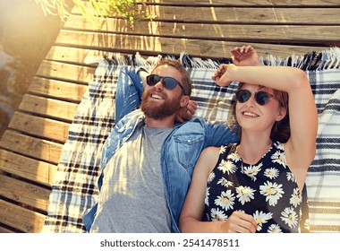 Lakeside, couple and smile with lying on ground on break with love, rest and affection for care. Above, outdoor and happy in relationship on blanket on valentines day for holiday to relax and bonding - Powered by Shutterstock