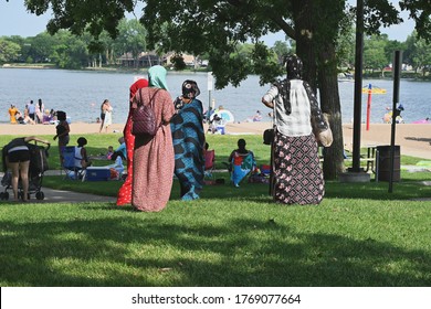 Lakeside Park, Big Lake, MN, USA - July 3, 2020. A Group Of Somali Women Gather To Enjoy The Sandy Beach.