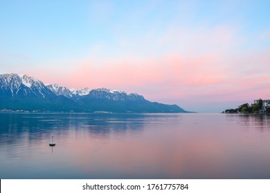 Lakeside picture of Genenva Lake with morning scenery reflexing on water surface :Geneva lake, Lausanne, Switzerland: 6/5/2019