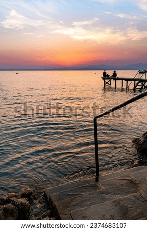 Lakeview at sunset from walkway at Cisano, Bardolino, Lake Garda, Italy