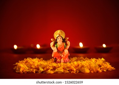 Lakshmi Puja, Laxmi Pujan, Diwali Oil Lamp Lit With Statue Of Goddess Laxmi On Lakshmi Pujan Or Pooja In Diwali, Goddess Lakshmi