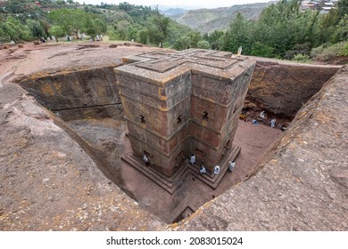 LALIBELA, ETHIOPIA - 30 MARCH, 2019: During an Ethiopian Orthodox service, Christians pray above and outside the UNESCO World Heritage Site of the rock-cut Church of Saint George.