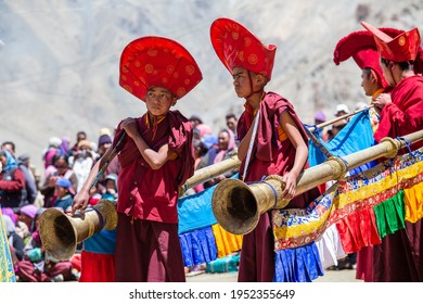 Lamayuru Gompa, Ladakh, India - june 14, 2015 : Young buddhist musicians playing the trumpet during the festival in monastery Lamayuru, Ladakh, North India