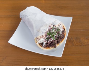 Lamb And Beef Gyro Served From A Mediterranean Food Cart In Portland, Oregon.