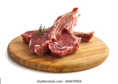 Lamb Chops On Wooden Board Isolated Over White