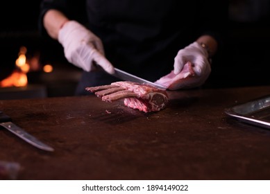 Lamb chops On a wooden cutting board chef preparing lamb - Powered by Shutterstock