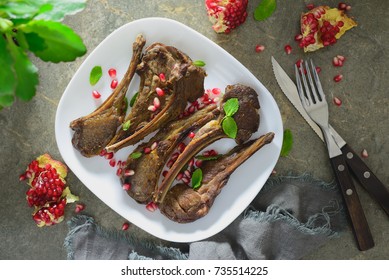 Lamb Chops Served With Pomegranate And Mint, Flat Lay Composition Of A Table Setting, Overhead View