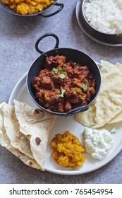 Lamb Curry With Mango Chutney, Naan Bread, Cucumber Raita And Papadum