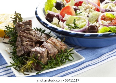 Lamb Kebabs Grilled On Rosemary Skewers, With Greek Salad.  Delicious!