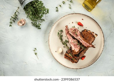 Lamb lion with thyme on a light background top view. copy space,
