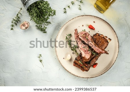 Lamb lion with thyme on a light background top view. copy space,