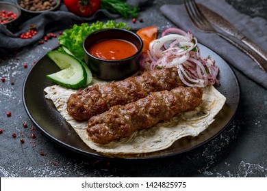 Lamb Lula Kebab On Black Plate