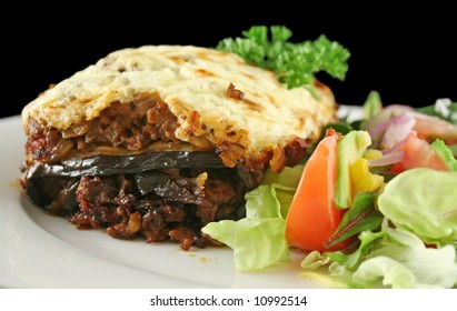 Lamb Moussaka With Egg Plant Cheese And Salad.