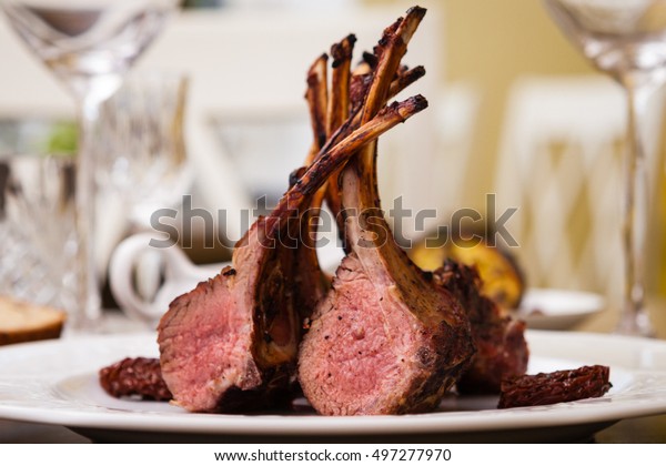 Lamb rack
with limoncello glaze served on a
plate