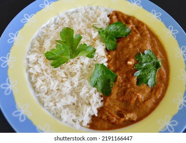 Lamb Rogan Josh Served With Rice And Parsley