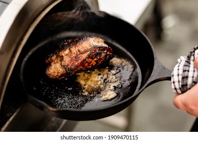 Lamb Rump Being Cooked In A Cast Iron Pan