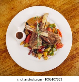 Lamb Shank With Vegetable Ratatouille, Top View, On Wood Table