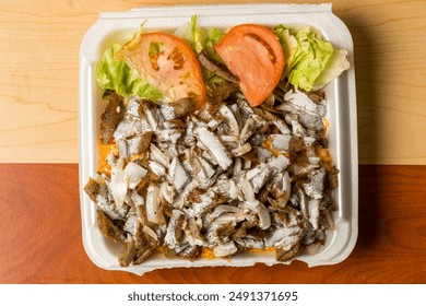 Lamb shawarma platter with salad and white sauce - Powered by Shutterstock