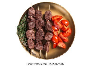 Lamb shish kebab grilled Skewers in a plate with tomato. Isolated on white background