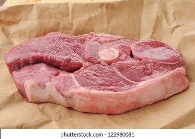 A Lamb Shoulder Chop On Butcher Paper