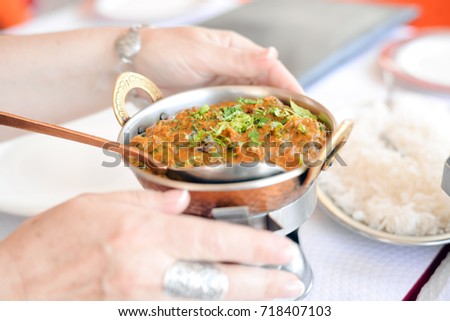 Lamb with spinach, close up of tasty indian food on light table background