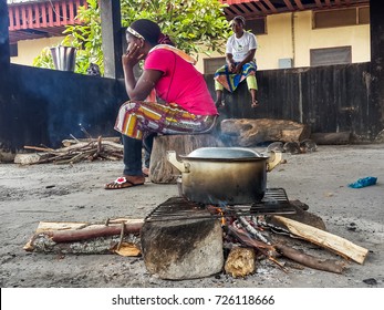 LAMBARENE, GABON, AFRICA - APRIL 10 2014: Unidentified African Women Cooking Meal Over Simple Wood Fire At Albert Schweitzer Hospital