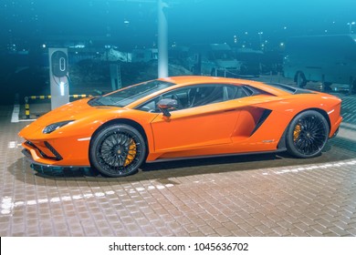 Lamborghini Aventador orange night on the streets city parking place. Russia, Saint-Petersburg. 13 March 2018