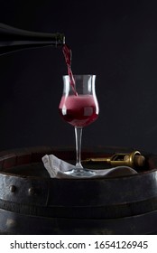 Lambrusco Grasparossa Poured Into The Glass With Foam And Bottle