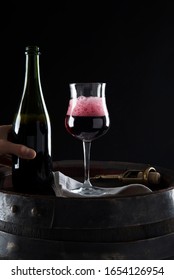 Lambrusco Grasparossa Poured Into The Glass With Foam And Bottle