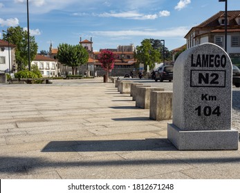 Lamego, Portugal - August 11, 2020: Kilometer milestone of the mystic national road 2, that crosses the country north to south. With the historic city center inviting a stop to get to know it.