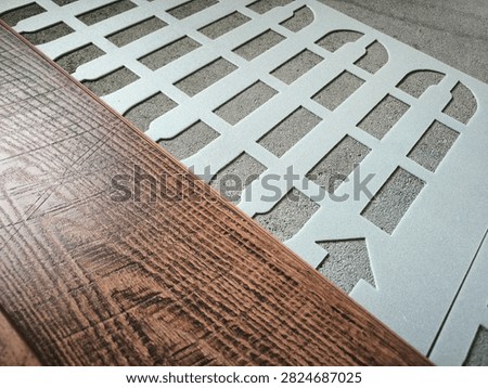 Laminate and sheet underlay for underfloor heating systems